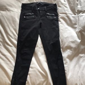 black jeans with leather detailing